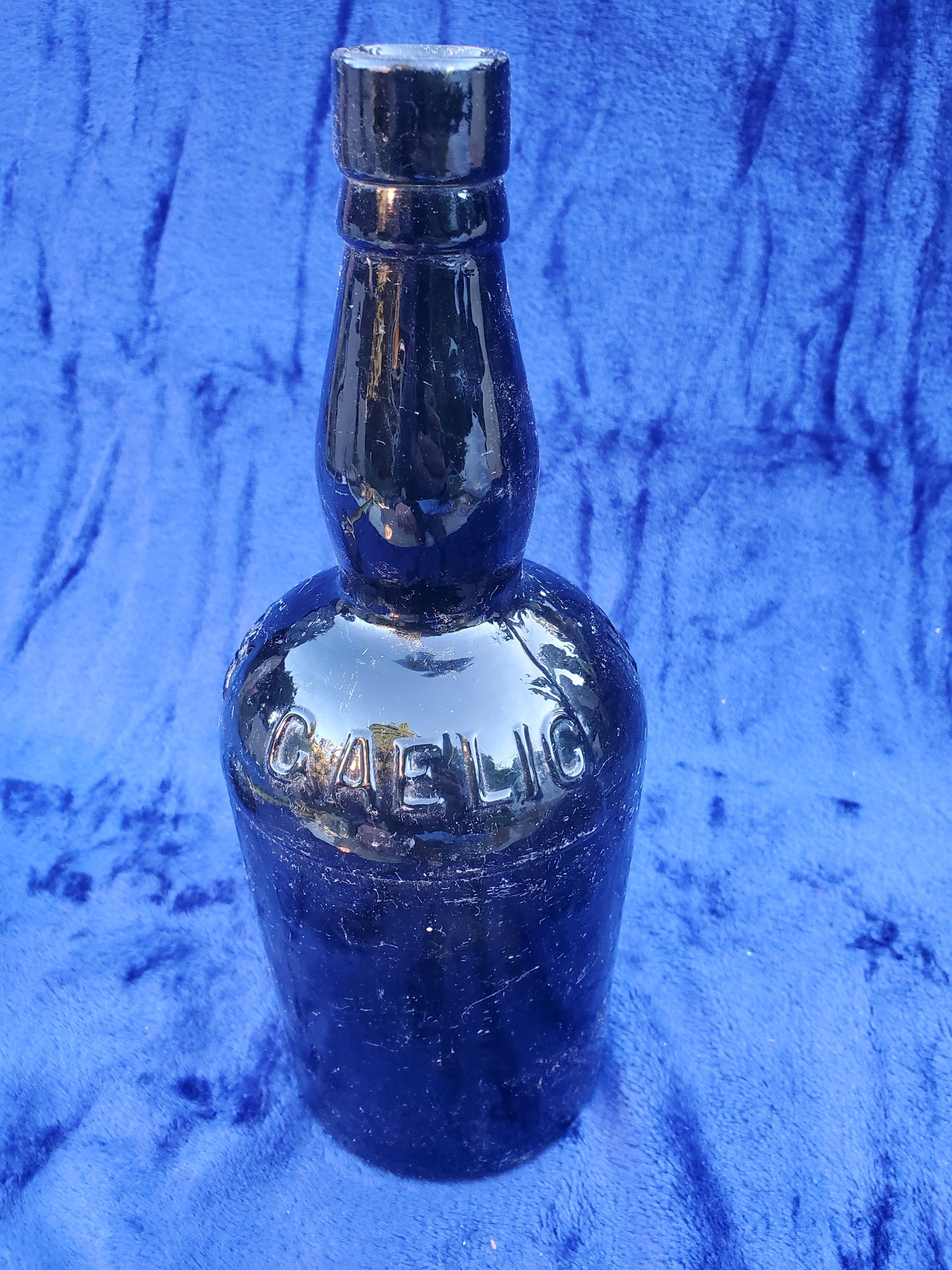 BLACK GLASS WHISKEY BOTTLE
