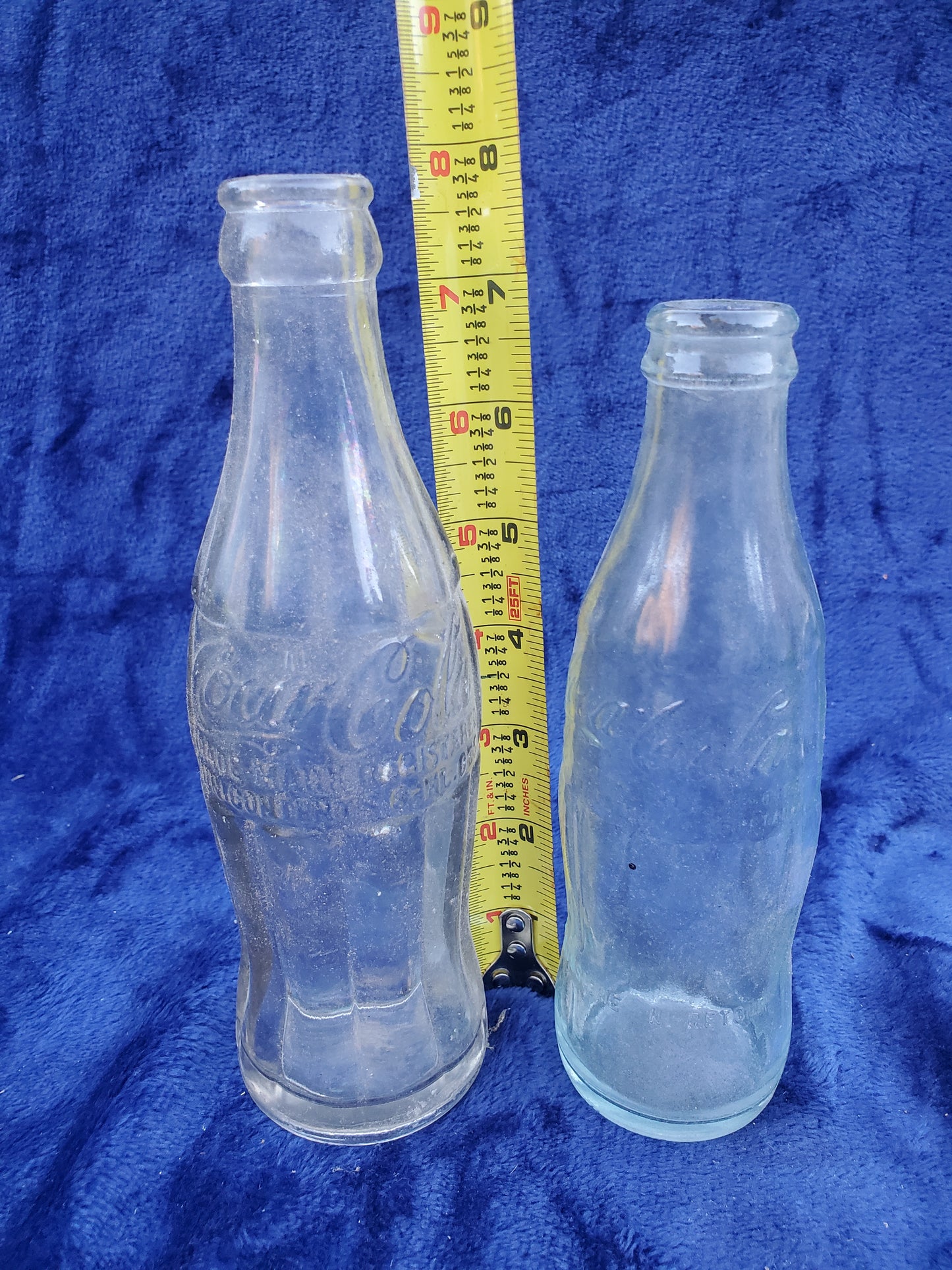 Two Embossed Coca-Cola Bottles 1920–1940