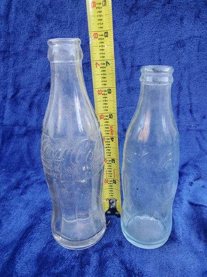 Two Embossed Coca-Cola Bottles 1920–1940
