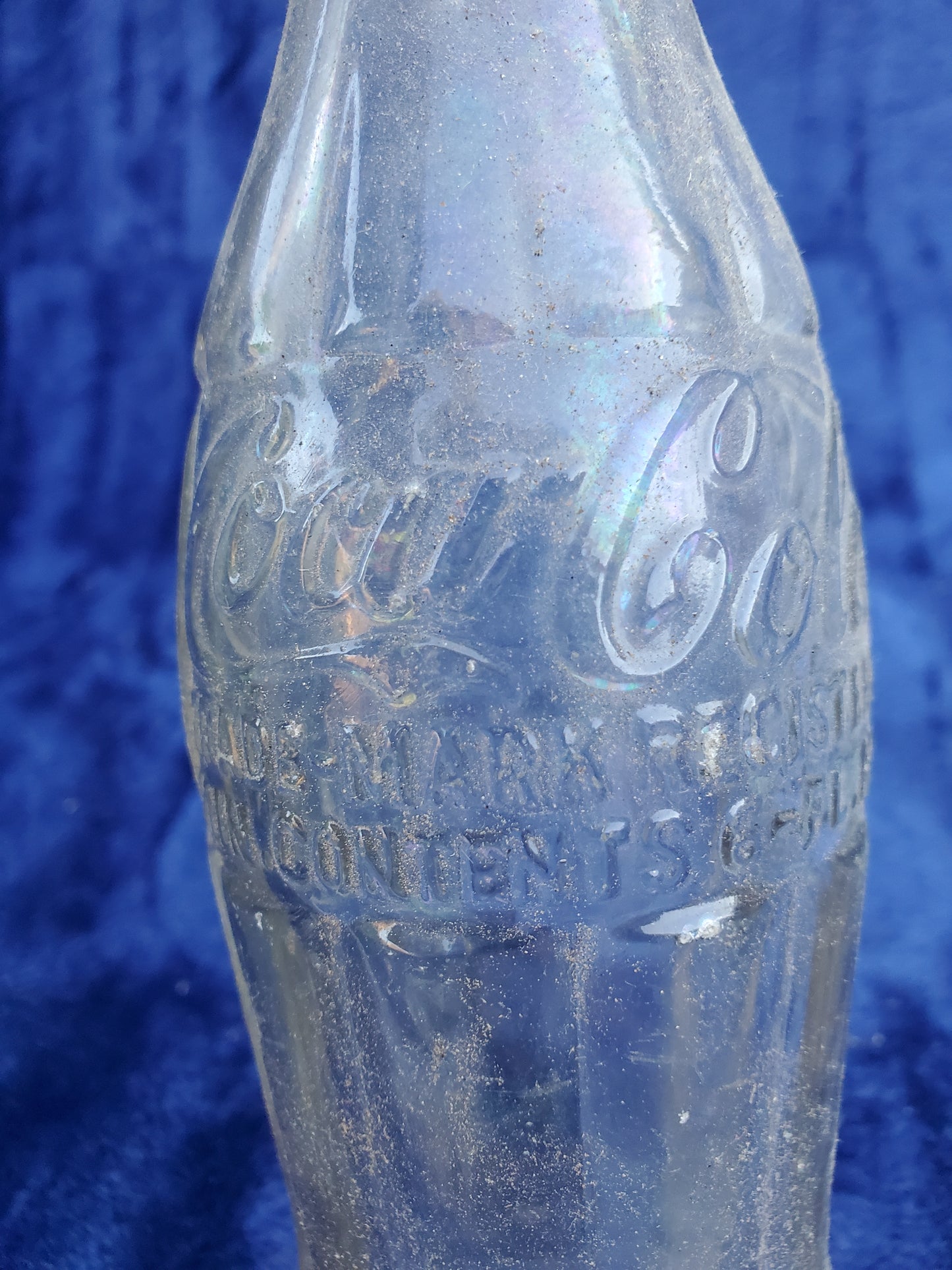 Two Embossed Coca-Cola Bottles 1920–1940