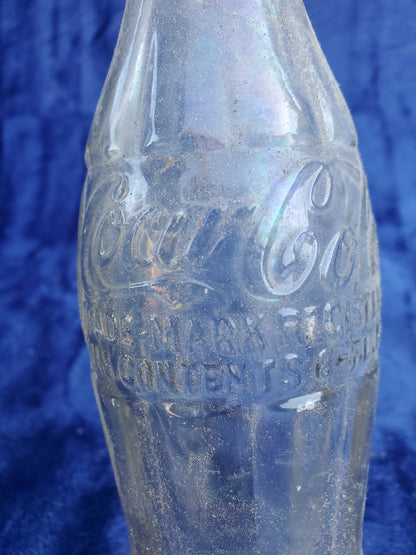 Two Embossed Coca-Cola Bottles 1920–1940