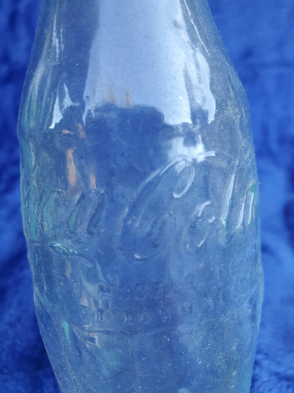 Two Embossed Coca-Cola Bottles 1920–1940