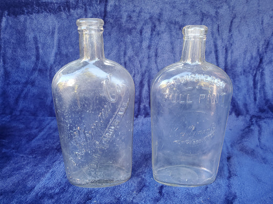Two (2) Purity Bourbon Flasks - M. Shumate