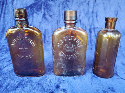Two (2) Vintage Whiskey Flasks - AMERICUS CLUB WHISKEY