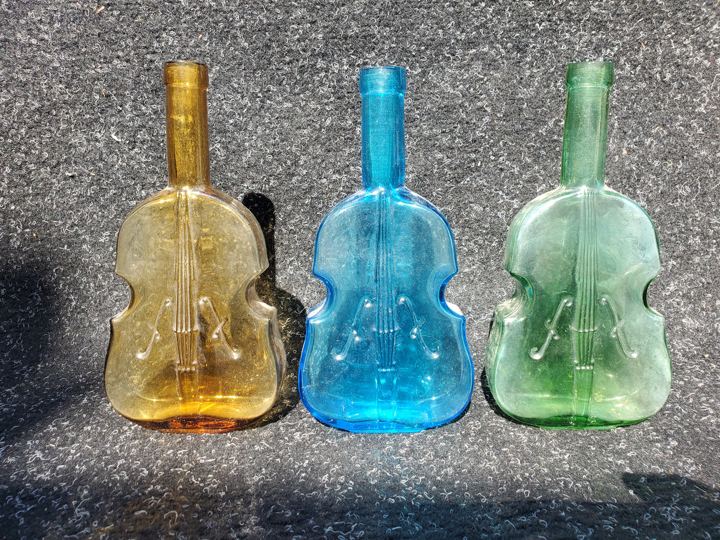 Set of four (4) Figural VIOLIN bottles (amber, 2 blue, green)