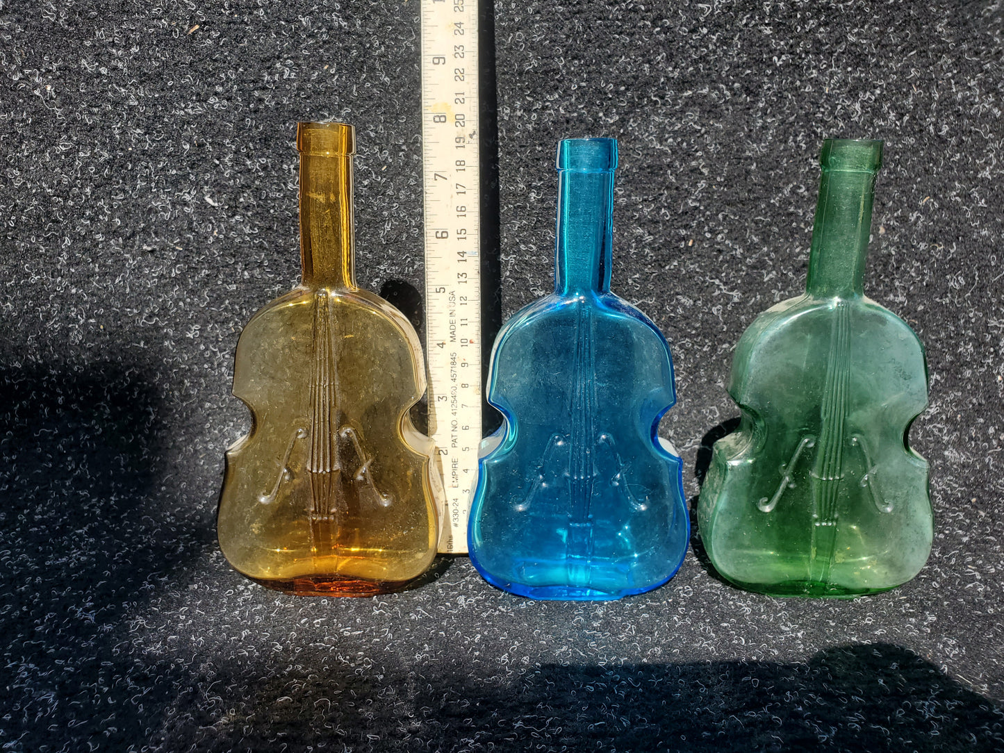 Set of four (4) Figural VIOLIN bottles (amber, 2 blue, green)