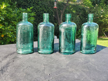 Four (4) matching Dr. Kilmer’s apothecary-style proprietary bottles