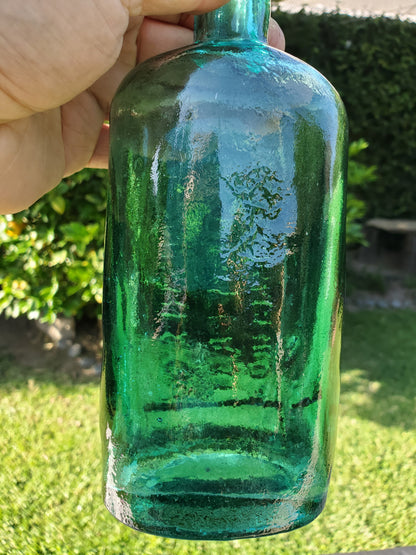 Four (4) matching Dr. Kilmer’s apothecary-style proprietary bottles