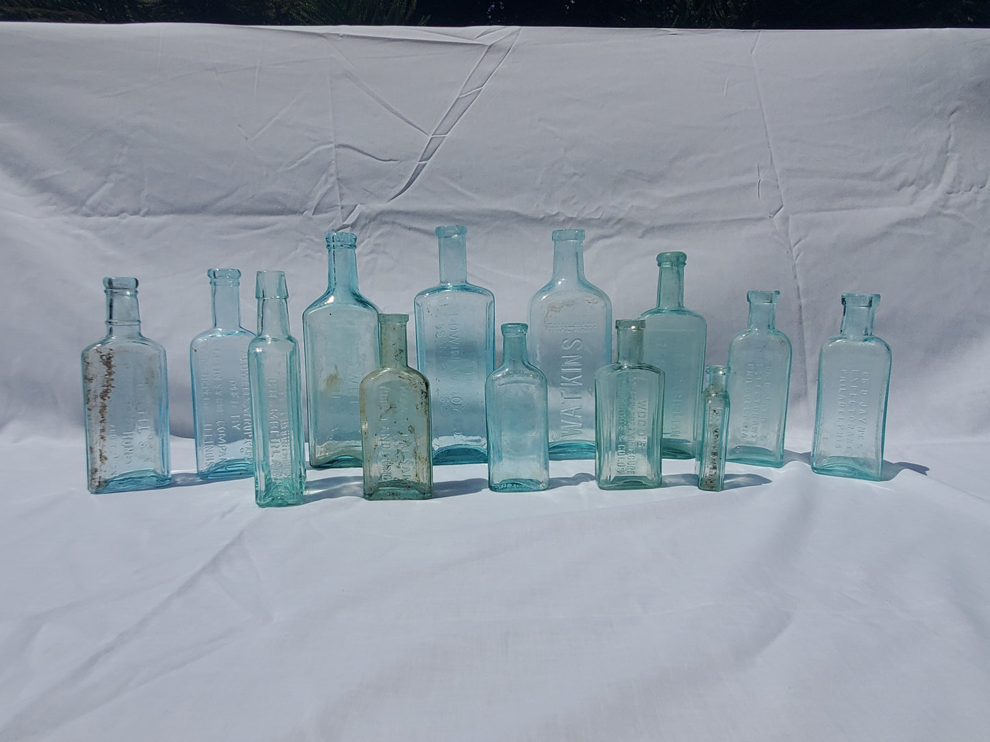 13 Antique Aqua Medicine & Apothecary Bottles – Embossed Glass Collection – 1800s/Early 1900s