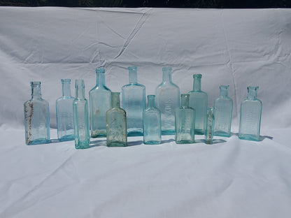 13 Antique Aqua Medicine & Apothecary Bottles – Embossed Glass Collection – 1800s/Early 1900s