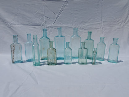 13 Antique Aqua Medicine & Apothecary Bottles – Embossed Glass Collection – 1800s/Early 1900s