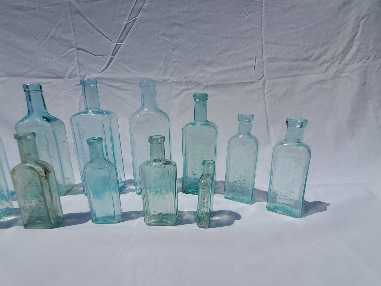 13 Antique Aqua Medicine & Apothecary Bottles – Embossed Glass Collection – 1800s/Early 1900s