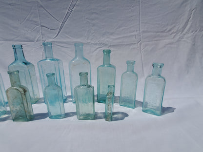 13 Antique Aqua Medicine & Apothecary Bottles – Embossed Glass Collection – 1800s/Early 1900s